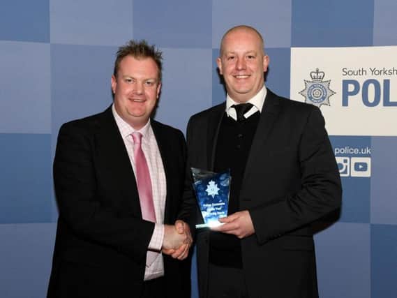 Awards sponsor Mark Huby, of Total Finance Options, presents the Police Constable of the Year Award to Pc Craig Davis