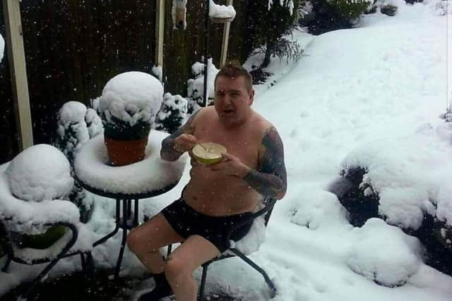 Ivor Hillman showing the Southerners how it's done - eating breakfast, semi-clad in the snow