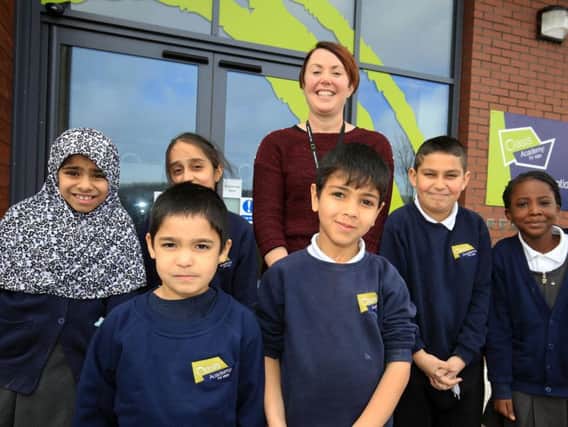 Principal Helen Round is pictured with pupils