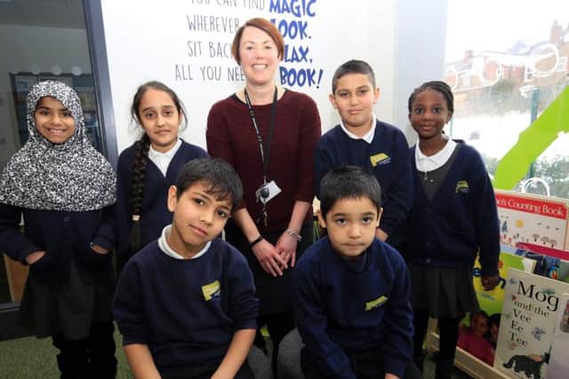 Principal Helen Round celebrates the Ofsted report with pupils