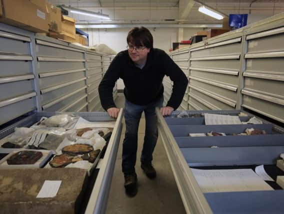 Alistair McLean with specimens of rocks and minerals at the Museums Sheffield store. Picture: Chris Etchells