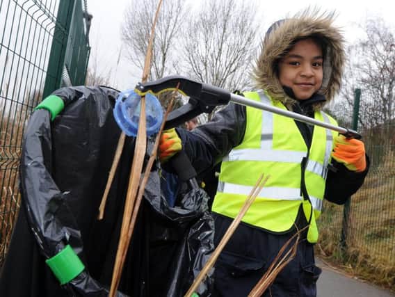 Kyla from Oasis Academy Watermead during a litter pick on a footpath near the school following concerns from residents. Picture: Andrew Roe.