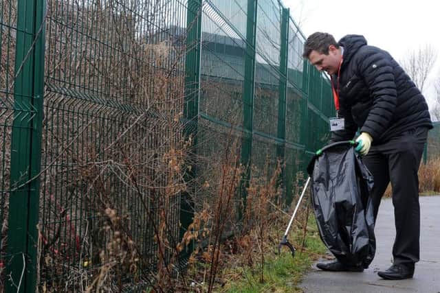 The Star's Sam Cooper on the litter pick. Picture: Andrew Roe.