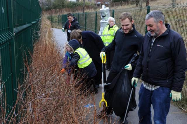 Students and staff from Oasis Academy Watermead during a litter pick on a footpath near the school following concerns from residents. Picture: Andrew Roe.