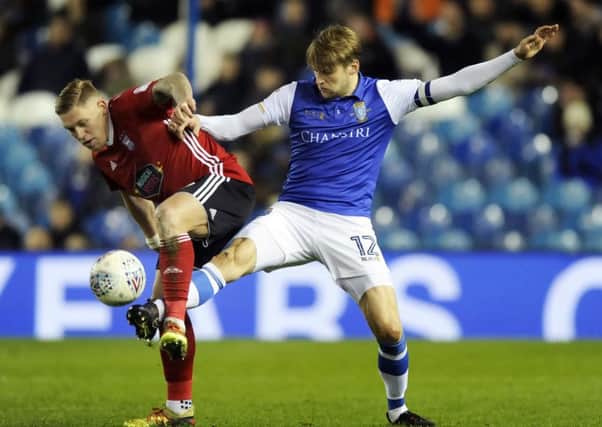 Owls skipper Glenn Loovens stretches out to stop Town's two goal Martyn Waghorn.....Pic Steve Ellis