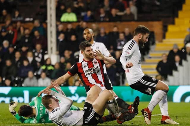 Ched Evans is denied by the Fulham defence
