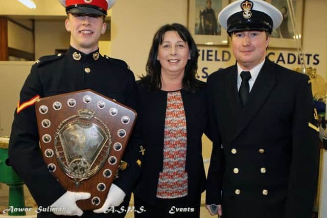 Teresa Smith with Royal Marine Cadet Mike Smith and Petty Officer Christopher Smith (photo: Anwar Suliman)