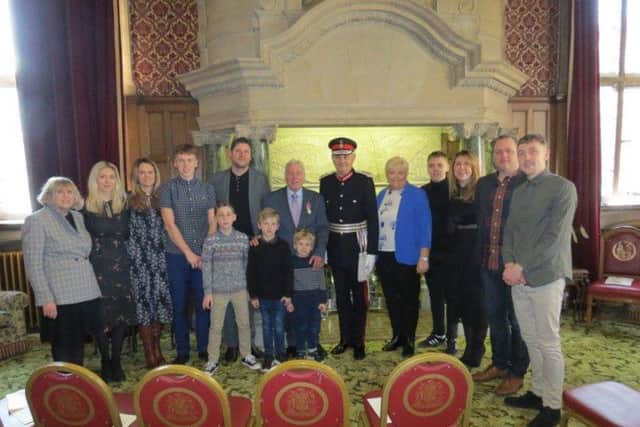 Martin Windle with friends and family at the investiture ceremony