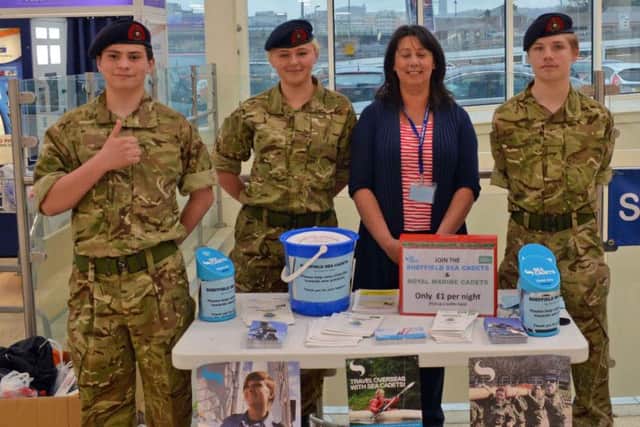 Teresa Smith with (l-r) Lewis Butler, Olivia Spankisman, Charlie Atkinson and Petty Officer Christopher Smith during a charity bag pack at Tesco