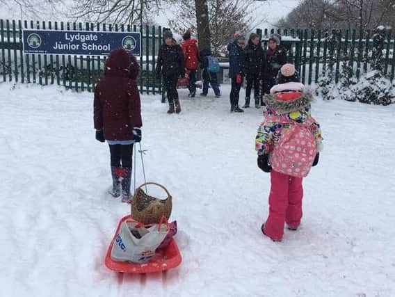 Children on their way to school in Sheffield last week in the snow