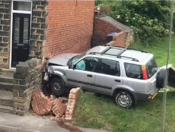 Vehicle crashes into house in Burncross Road.