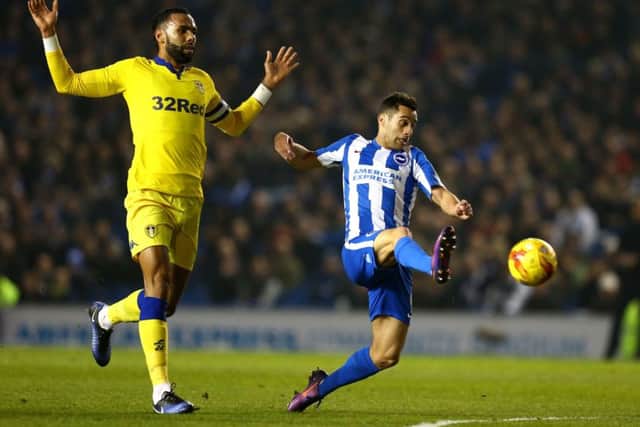 Brighton and Hove Albion's Sam Baldock (right) in action against Leeds United