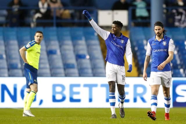 Sheffield Wednesday's Lucas Joao (middle) celebrates scoring the games first goal with Derby County's Chris Baird (left) looking dejected during the Sky Bet Championship match at Hillsborough, Sheffield.