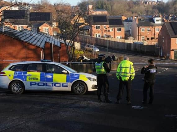 Police officers in Burngreave this morning after a young man was stabbed to death
