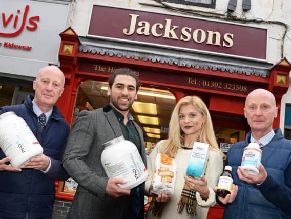 Twins Simon and John Shepherd, pictured at Jacksons Herbalists, on Printing Office Street, with the new owners Arman Mantella and Lydia Georgiou. Picture: Marie Caley NDFP Jacksons New Owners MC 1