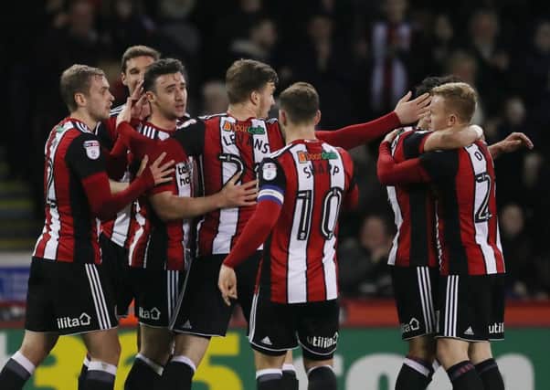 Enda Stevens is congratulated after putting the Blades in front against Burton