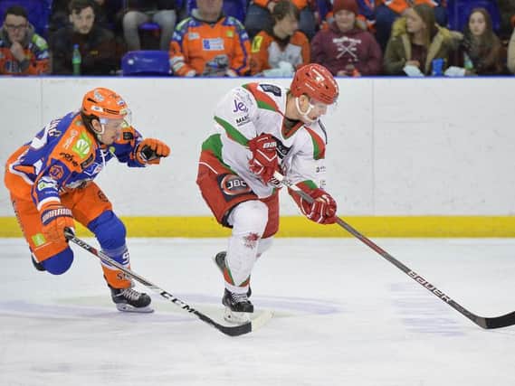 Jonas Westerling tracks a Cardiff Devils rival