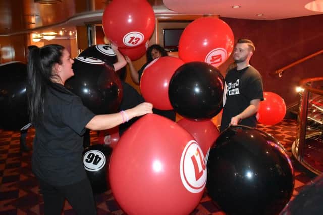 Giant bingo balls fall during the Bonkers Bingo minicruise