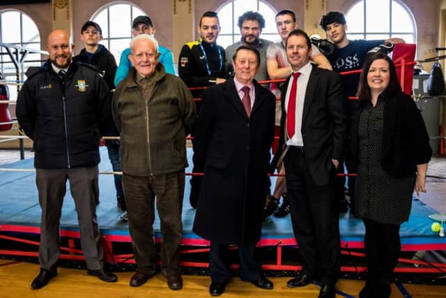 Left to right: Front row - Ricky Hunt from SWFC, Peter Atkinson (Trustee of Dearne Valley Personal Development Centre - DVPDC), Sir Dave Richards, Jason Mace from Gala Tent, Jackie Irwin from DVPDC. Back row - Students from the Dearne Valley Personal Development Centre with Josh Wale (centre) with John Irwin of DVPDC.