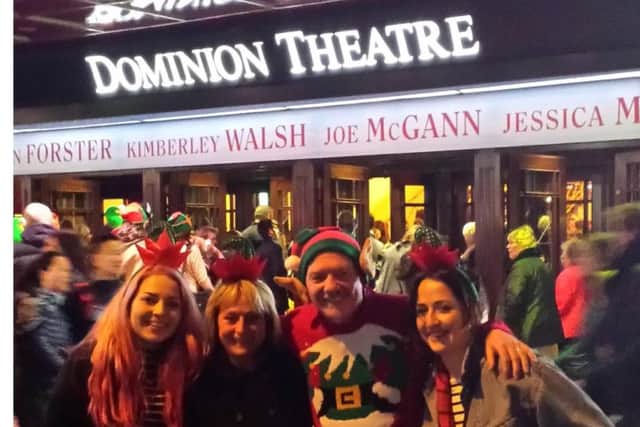 Molly and her family at the Dominion Theatre in London.