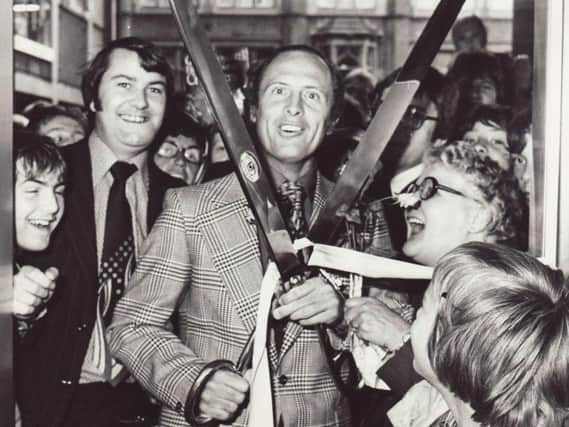 Geoffrey Boycott with the giant scissors which have gone missing. Picture: Taylor's Eye Witness