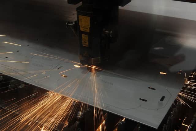 Laser cutting at AET Engineering.