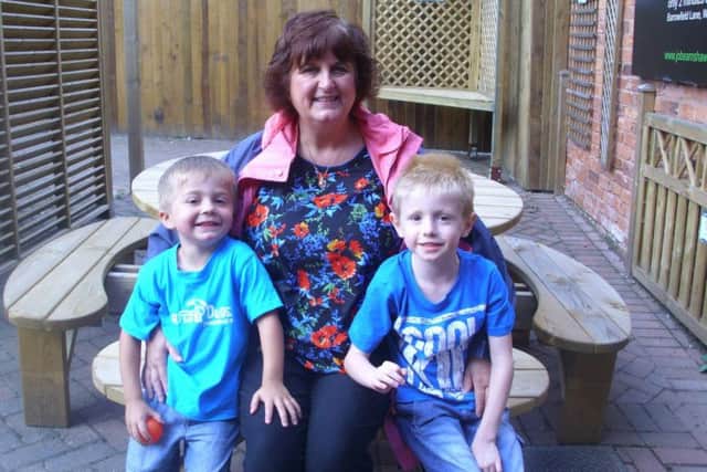 Sheila with two of her grandchildren.