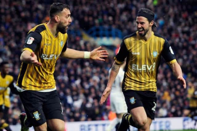 Atdhe Nuhiu with George Boyd after the striker's opening goal against Leeds United
