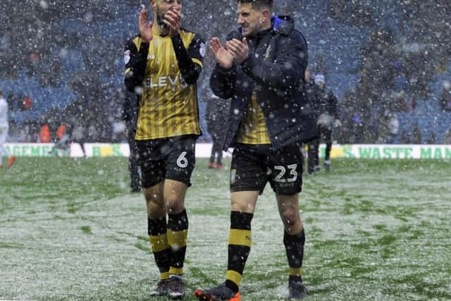 The Owls pair of Morgan Fox and Sam Hutchinson celebrating victory in the Snow at Elland Road....Pic Steve Ellis