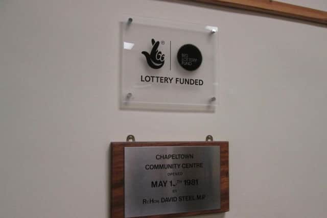The plaque showing the opening date of the community centre.