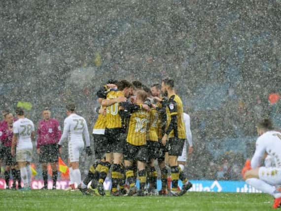 Owls players celebrate their win over Leeds United