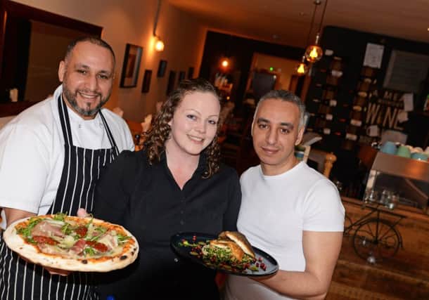Brothers Rachid and Abdellatif Nabili, pictured with Freya Macdonald, manager, at Olive Mediterranean restaurant, Sheffield. Picture: Marie Caley NSTE Olive MC 1
