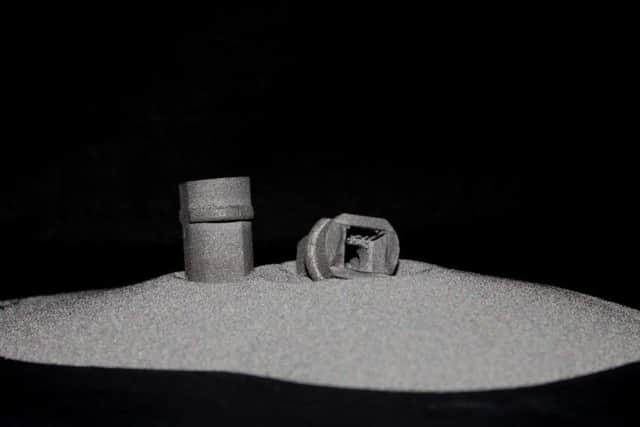 Metalysis titanium metal powder and a 3D printed part.