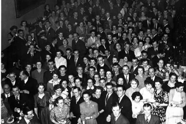 Can anyone recognise friends or loved ones from this 1950`s photograph of the `James Neil`s` annual dance taken at the Cutler`s Hall.
