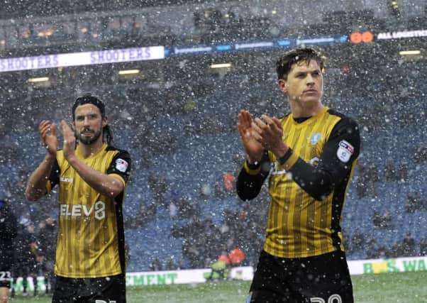 Adam Reach and George Boyd applaud supporters after the win at Leeds United