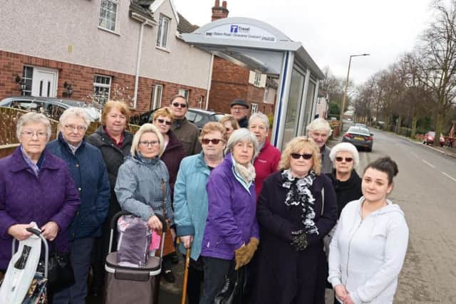 Sasha Bonfield (far right) and other exasperated passengers at the bus stop on Station Road in Arksey (photo: Marie Caley)