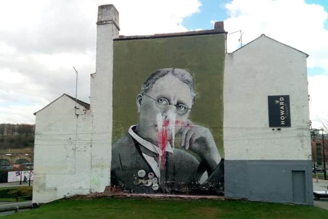 The Harry Brearley mural has been splattered with paint
