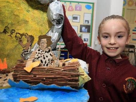 Poppy Megson, eight, with her home learning model