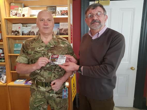 Ashworth Barracks Museum volunteer guide Mick Brand dropping off 1,000 free children's tickets for the attraction at Doncaster Tourist Information Centre.