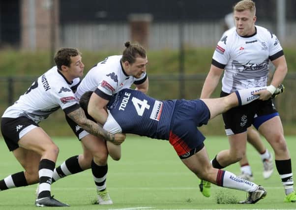 Sheffield Eagles: Wolfpack get to grips with Eagles Joshua Toole. .Pic Steve Ellis
