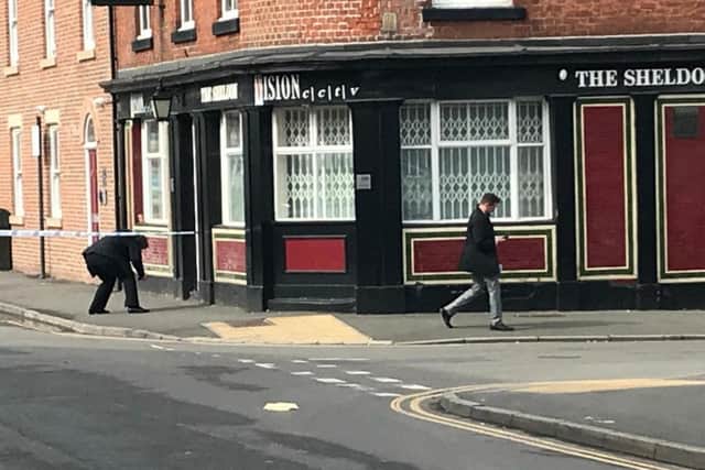 Detectives were seen carrying out enquiries inside the cordon on Hill Street. Picture: George Torr/The Star