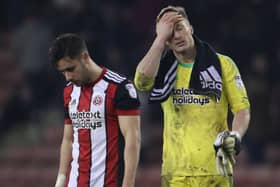 George Baldock  and Simon Moore dejected after conceding in the last minute against Cardiff City. Pic: Simon Bellis/Sportimage