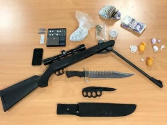 Drugs, weapons and cash were found during a police raid in Rotherham