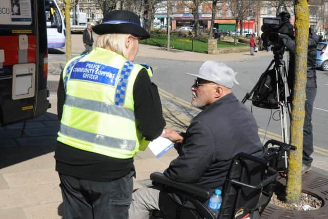 A PCSO speaks to a member of the public. Picture: Sam Cooper/The Star.