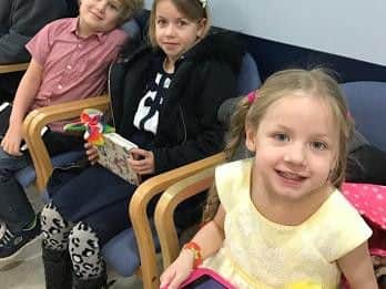 Her three children wait for her at Weston Park Hospital (from left to right: Kristian, Franchesca and Holly)