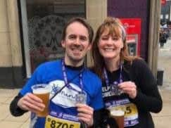 John Offord celebrates with a beer after completing his first ever half marathon