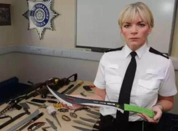 Det Supt Una Jennings with some weapons handed in as part of a recent surrender scheme aimed at making the streets of South Yorkshire safer