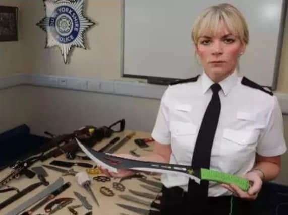Det Supt Una Jennings with some weapons handed in as part of a recent surrender scheme aimed at making the streets of South Yorkshire safer