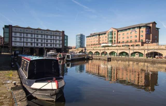 Victoria Quays remains hidden and separated from the city centre by a dual carriageway, the book says