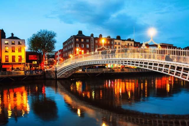 Walk over Dublin's famous Ha'penny Bridge